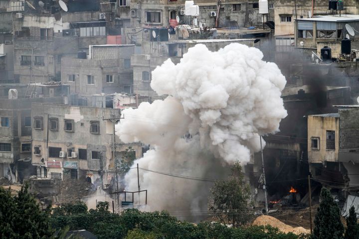 Israeli soldiers detonate an explosive device during a military raid in the West Bank refugee camp of Nur Shams, Tulkarem, on Sunday, Feb. 9, 2025.