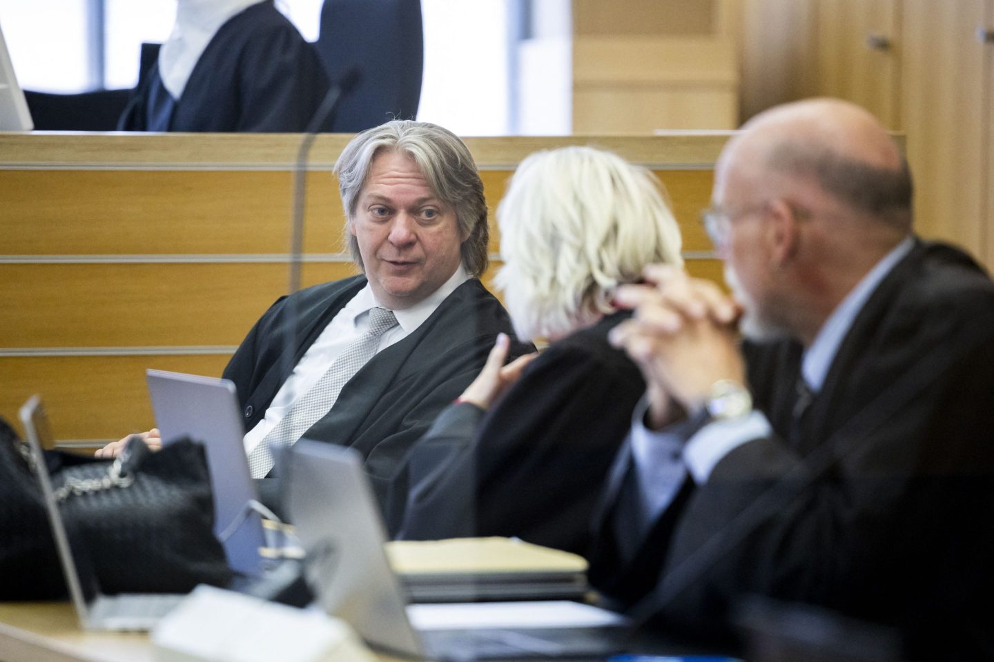 Defence lawyer Marc Langrock (L) attends the trial against four former Volkswagen executives, charged with misconduct over their role in the carmaker's manipulation of diesel emissions testing, in Braunschweig, northern Germany, on April 16, 2025. 