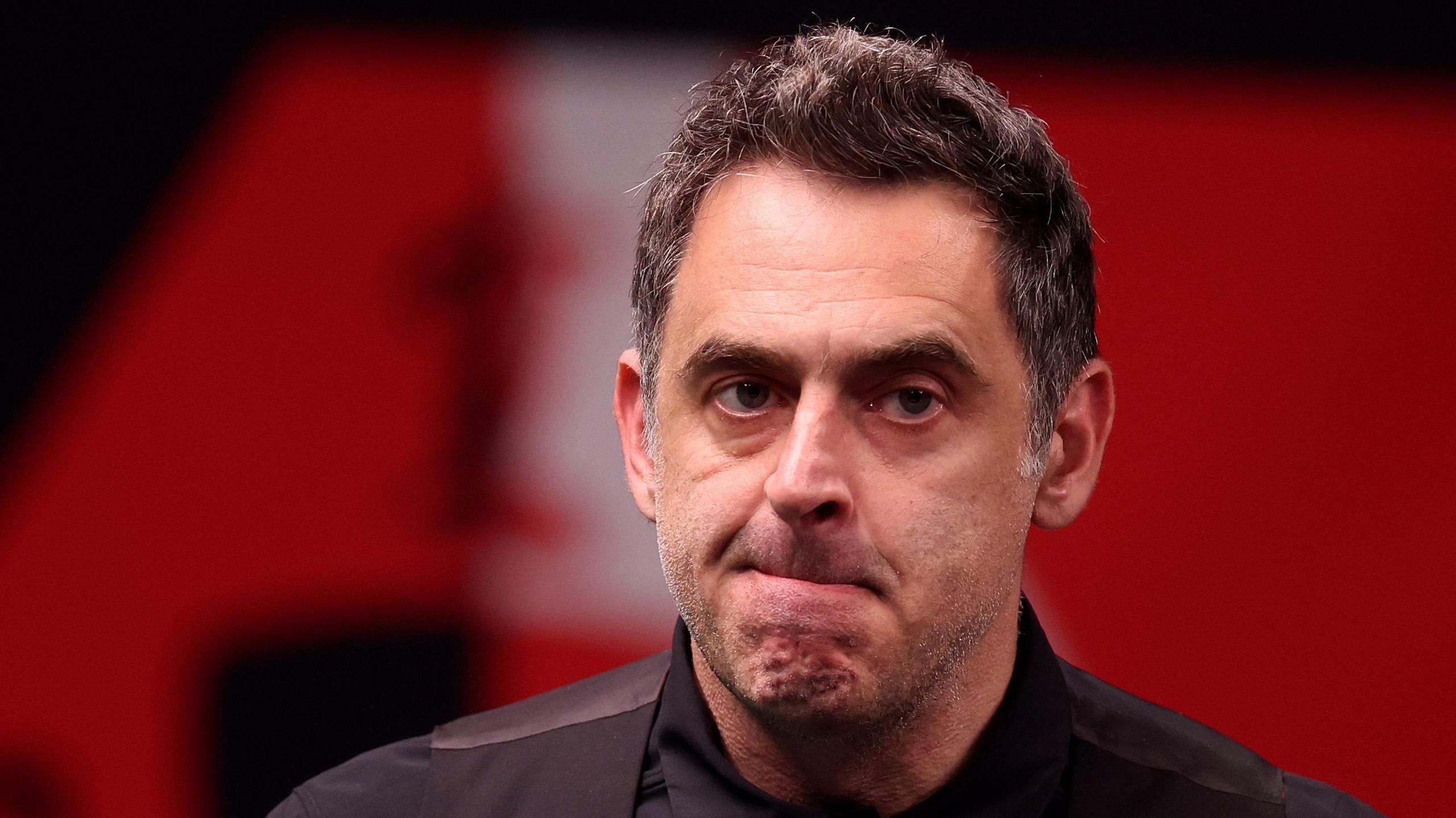 Ronnie O'Sullivan walks out of the Crucible