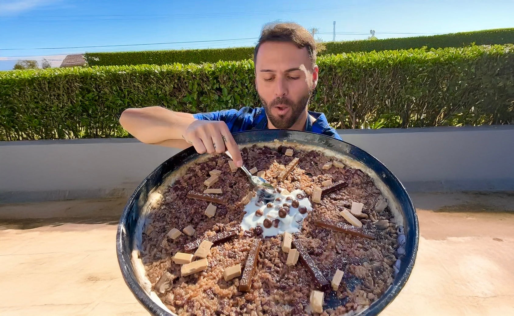 The Toronto native has found viral success, and no shortage of controversy, by blending Spanish culinary tradition with fast food and candy. Here, he makes a KitKat paella.
