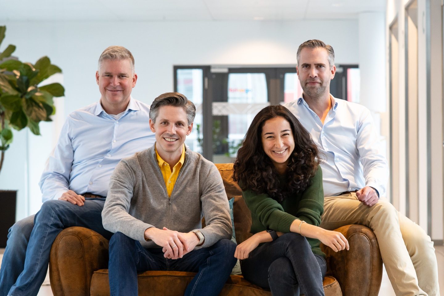 Trivago leaders sit on a couch together