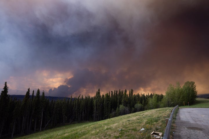 Wildfire smoke above Highway 97, north of the Buckinghorse River near Trutch, British Columbia, Canada, on Friday, May 30, 2025. Wildfires are threatening about 5% of Canada's crude output as a blaze in Alberta's oil sands region spreads and approaches major production sites. (Photographer: Nasuna Stuart-Ulin/Bloomberg via Getty Images)