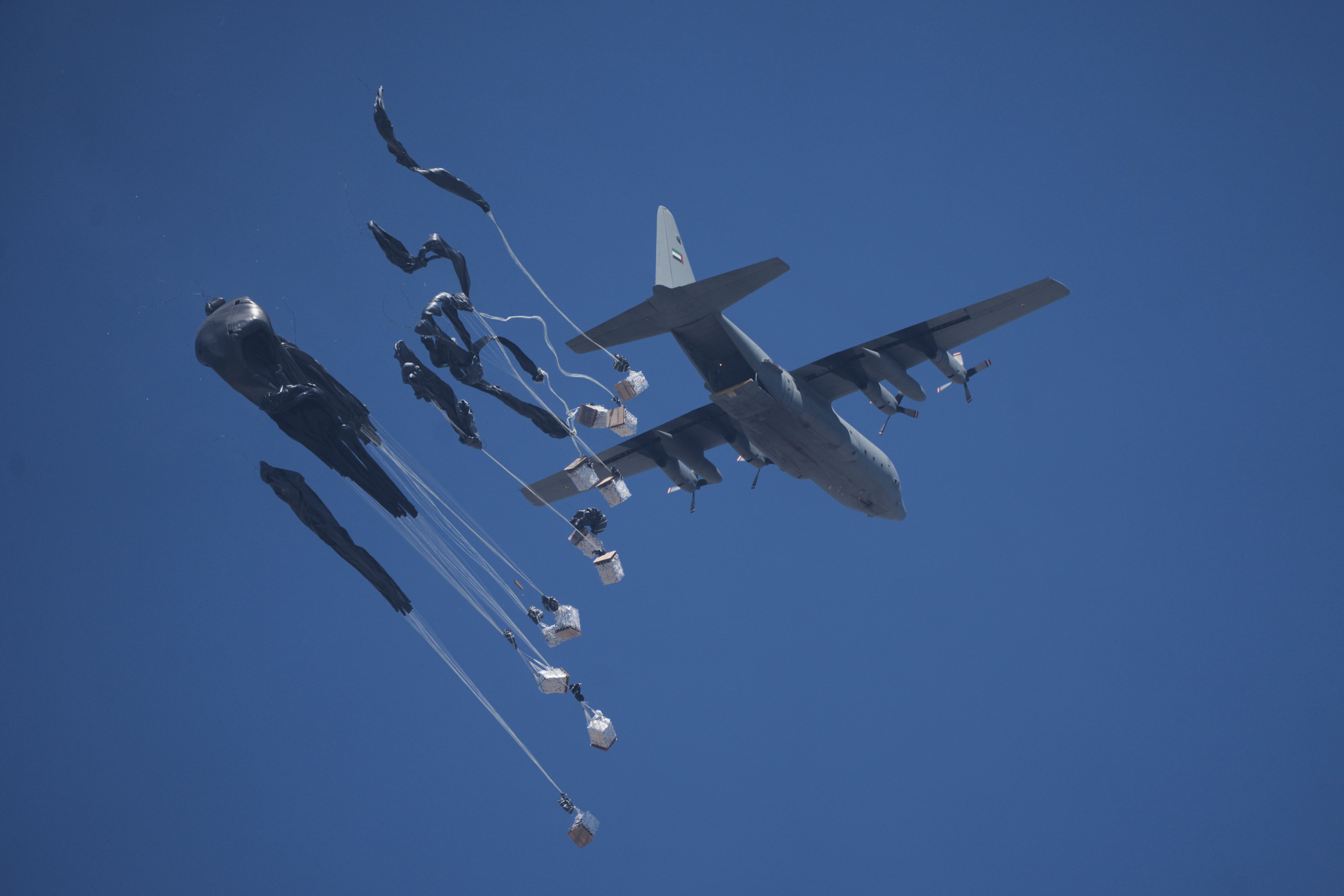 Humanitarian aid is airdropped to Palestinians over Gaza City, Gaza Strip, Sunday, July 27, 2025. (AP Photo/Jehad Alshrafi)