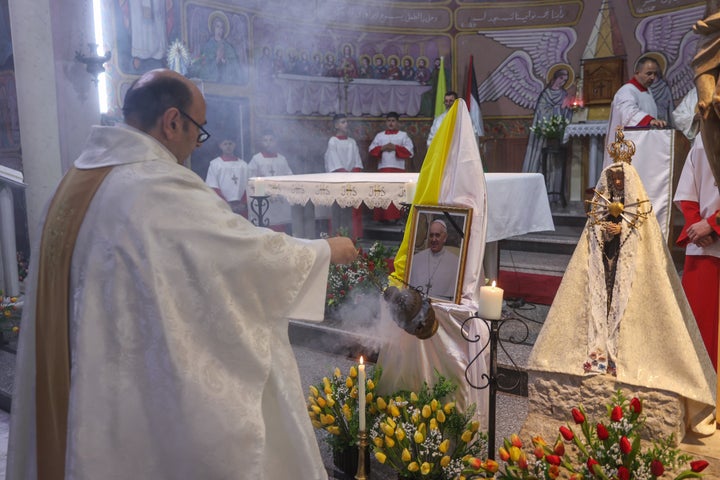 Members of the clergy hold mass for late Pope Francis at the Holy Family Catholic Church in Gaza City on April 21, 2025. An Israeli airstrike hit Gaza's only Catholic church on July 17, 2025, killing at least three people and wounding several more, including the parish priest who spoke regularly with Francis.