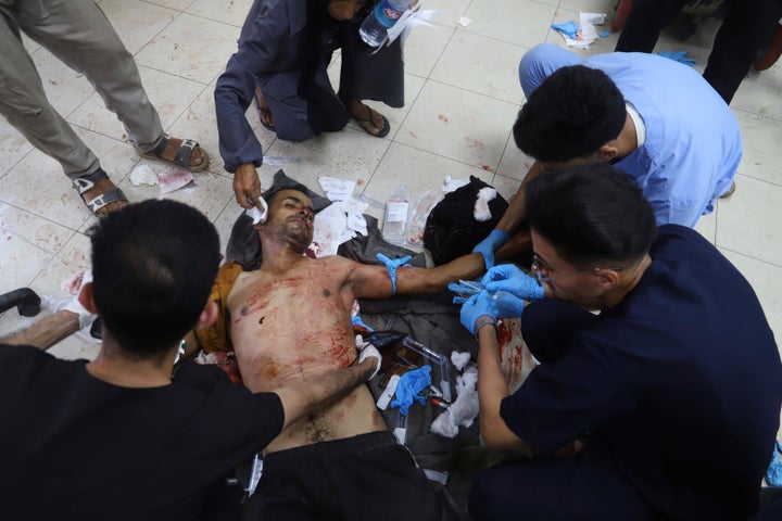 Medical staff treat a Palestinian man who was wounded while returning from a Gaza Humanitarian Foundation distribution center, at Nasser Hospital in Khan Younis, Gaza, on June 30.
