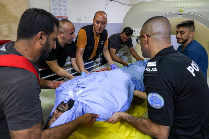 Medics move the body of 35-year-old Thameen Dawabsheh from Rafidiya Hospital in the West Bank city of Nablus, on Aug. 13, 2025. An Israeli settler fatally shot the Palestinian man in the village of Duma.