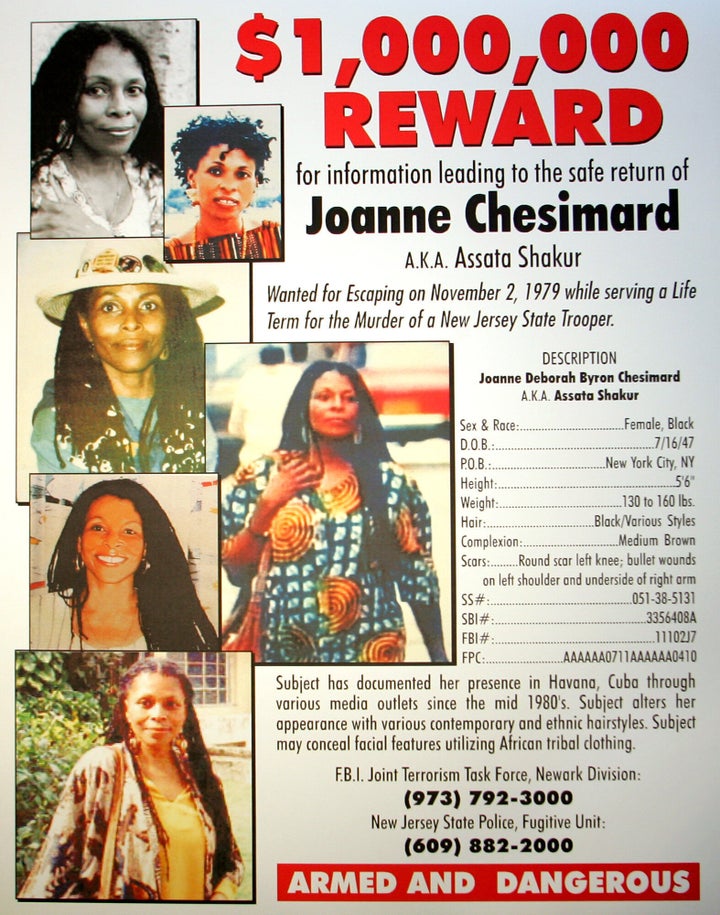 FILE - A reward poster announcing the federal bounty for the capture of convicted killer Joanne Chesimard, who used the name Assata Shakur, seen in West Trenton, N.J. on Monday, May 2, 2005. (AP Photo/File)