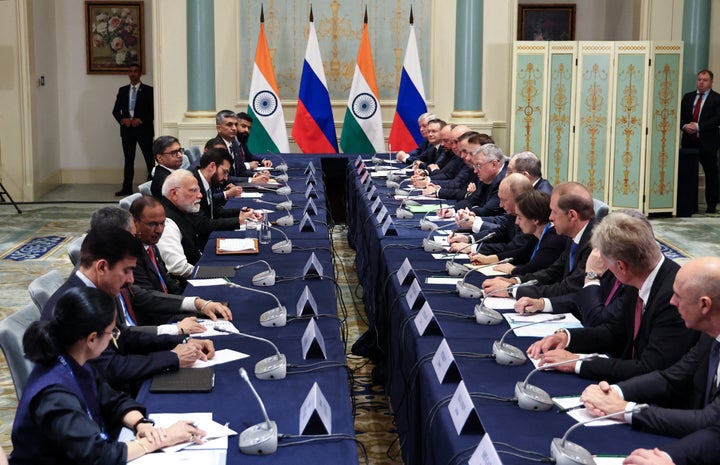 In this pool photograph distributed by the Russian state agency Sputnik, Russia's President Vladimir Putin and Indian Prime Minister Narendra Modi hold a meeting on the sidelines of the Shanghai Cooperation Organisation (SCO) Summit in Tianjin on September 1, 2025. (Photo by Alexander KAZAKOV / POOL / AFP via Getty Images)