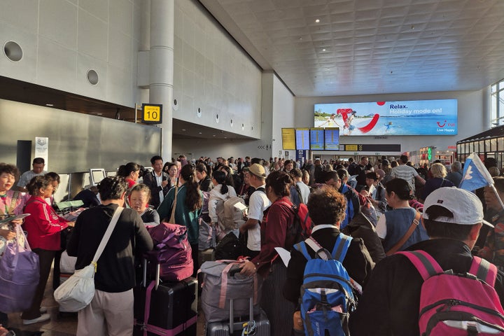 Passengers wait as they queue up at a check-in area of Brussels Airport in Brussels on Sept. 20, 2025, after the airport's system was hit by a "cyberattack" overnight on September 19. 