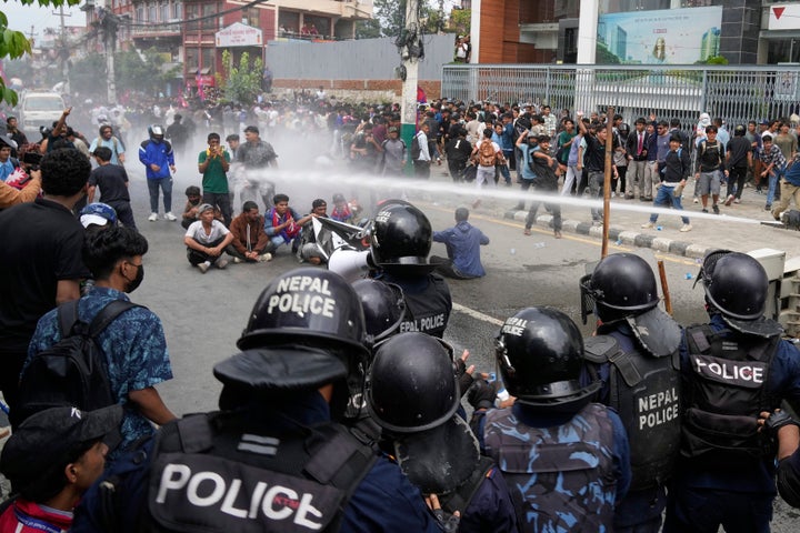 Riot police use a water cannon on protesters outside Parliament in Kathmandu, Nepal, Monday, Sept. 8, 2025.