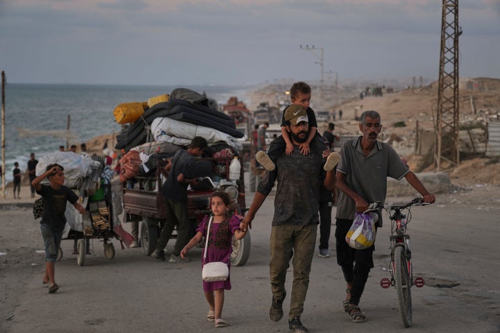 Displaced Palestinians flee northern Gaza along the coastal road toward the south, as Israel announced an expanded operation in Gaza City, on Sept. 16, 2025. 