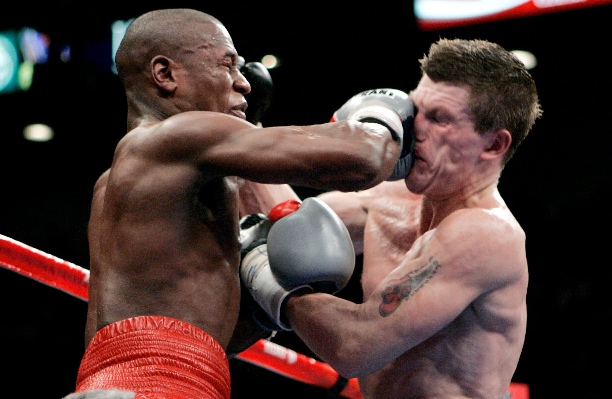 Floyd Mayweather Jr., left, punches Ricky Hatton, right, during their WBC welterweight boxing title fight at the MGM Grand hotel-casino in Las Vegas in 2007.