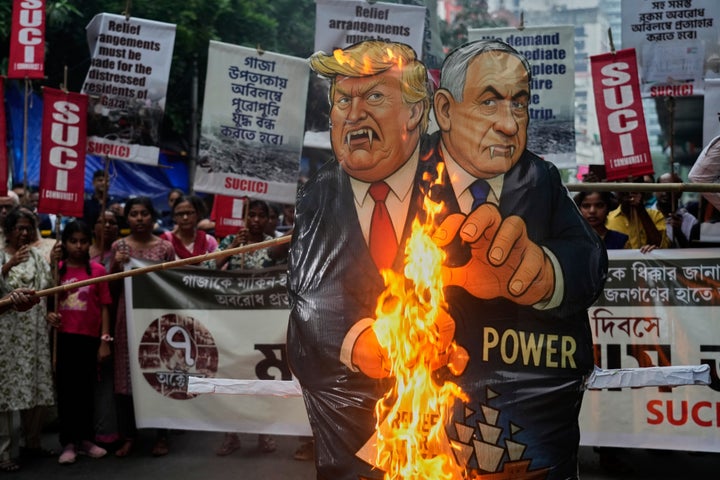 Demonstrators with the Socialist Unity Center of India-Communist (SUCI-C) burn a joint effigy of U.S. President Donald Trump and Israeli Prime Minister Benjamin Netanyahu near the U.S. consulate, at a protest in solidarity with the Global Sumud Flotilla after the Israeli Navy intercepted ships, in Kolkata, India, on Oct. 7, 2025.