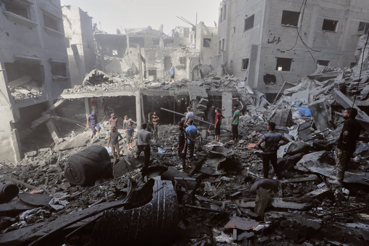 Palestinians inspect the rubble of a building, destroyed by an Israeli army strike at Al-Shati camp in Gaza City, on Oct. 29, 2025.