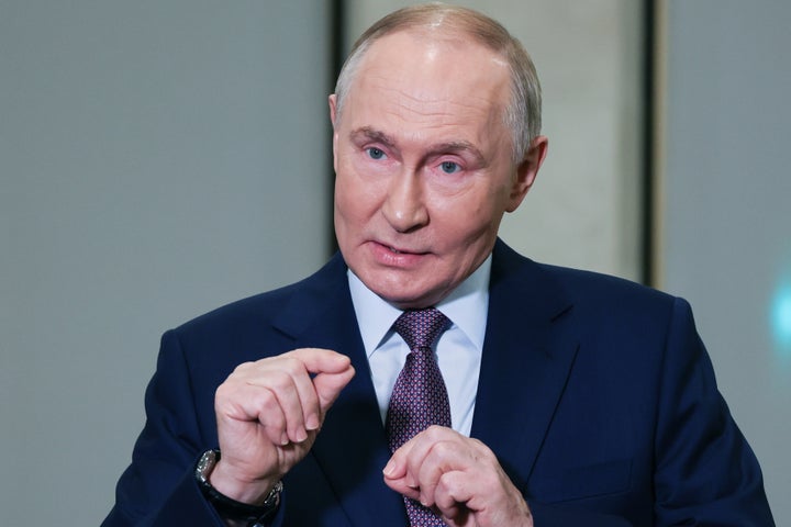 Russian President Vladimir Putin gestures while speaking to journalists on the sidelines of the Russian Geographical Society congress at the State Kremlin Palace in Moscow, Russia, on Oct. 23, 2025.
