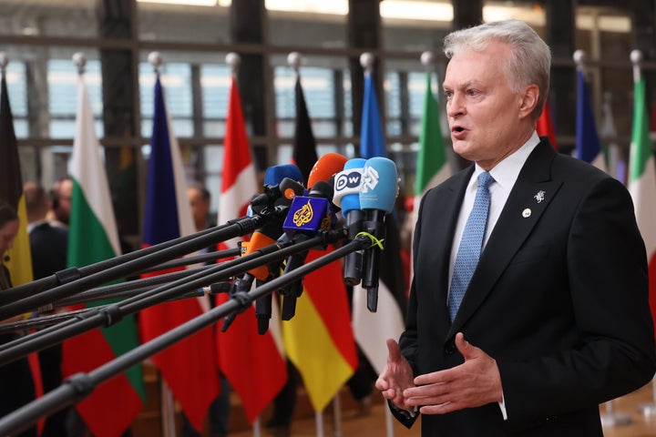 Lithuania's President Gitanas Nauseda speaks with the media as he arrives for an EU Summit at the European Council building in Brussels, on Oct. 23, 2025.