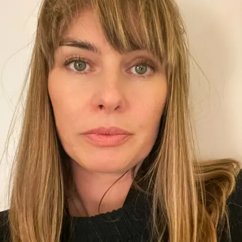 Katie Curran Katie Curran, a woman with green eyes, with blonde shoulder length hair