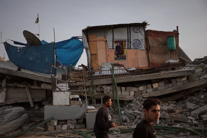 A tent sheltering displaced Palestinians stands atop rubble left by Israeli air and ground operations in Gaza City Saturday, Nov. 29, 2025. (AP Photo/Abdel Kareem Hana)