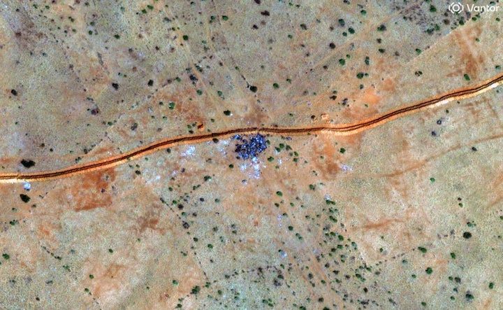 Vantor satellite imagery shows a cluster of burned vehicles along a dirt berm northwest of El Fasher in Sudan, on Oct. 30, 2025.
