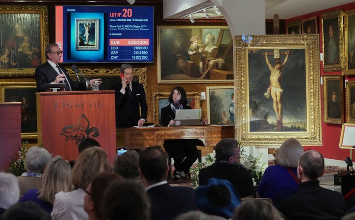 Auction officer Jean-Pierre Osenat gestures as the long-lost painting "Crucifixion of Jesus Christ" by Baroque master Peter Paul Rubens was sold at auction for 2.3 million euros.
