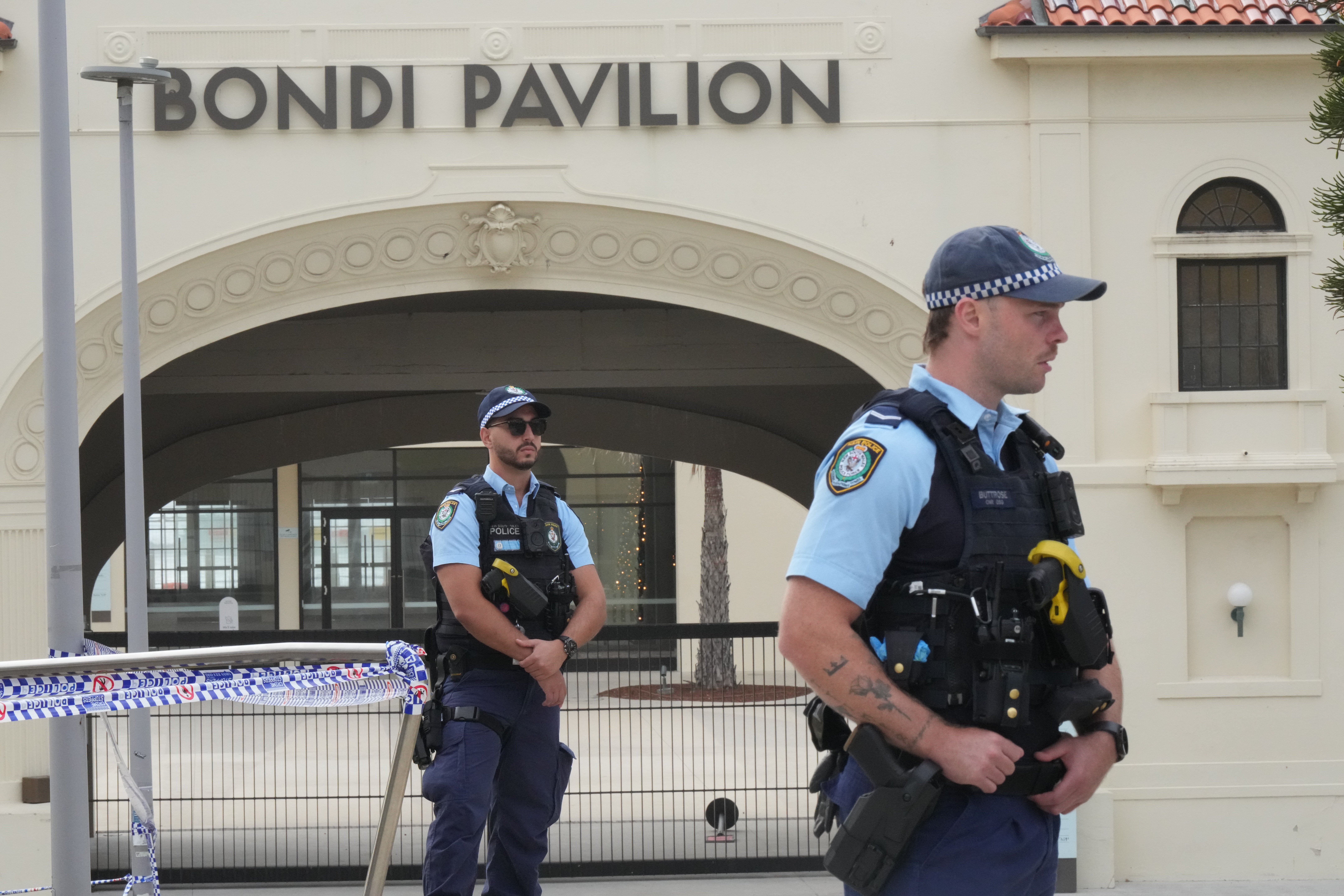 Police patrol in the early morning following a shooting Sunday at Sydney's Bondi Beach, Monday, Dec. 15, 2025. (AP Photo/Mark Baker)