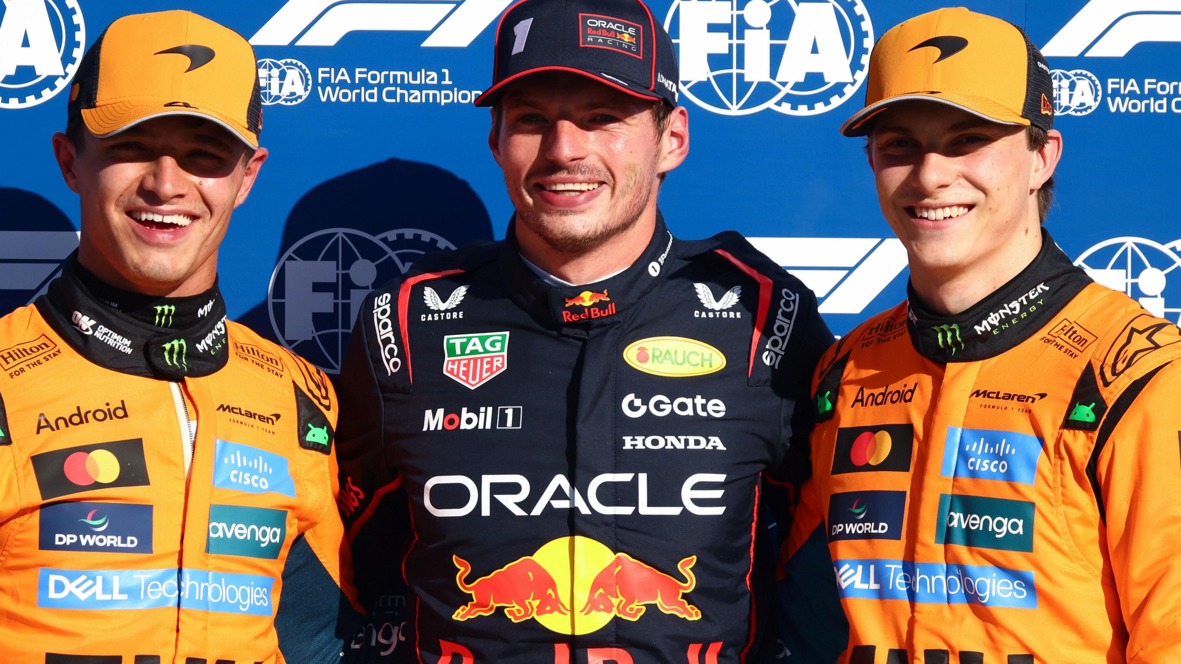 Red Bull's Max Verstappen and McLaren's Lando Norris and Oscar smile as they pose for pictures after the 2025 Italian Grand Prix