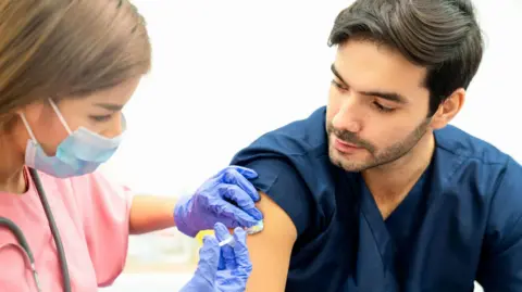 Getty Images A man being given an injection