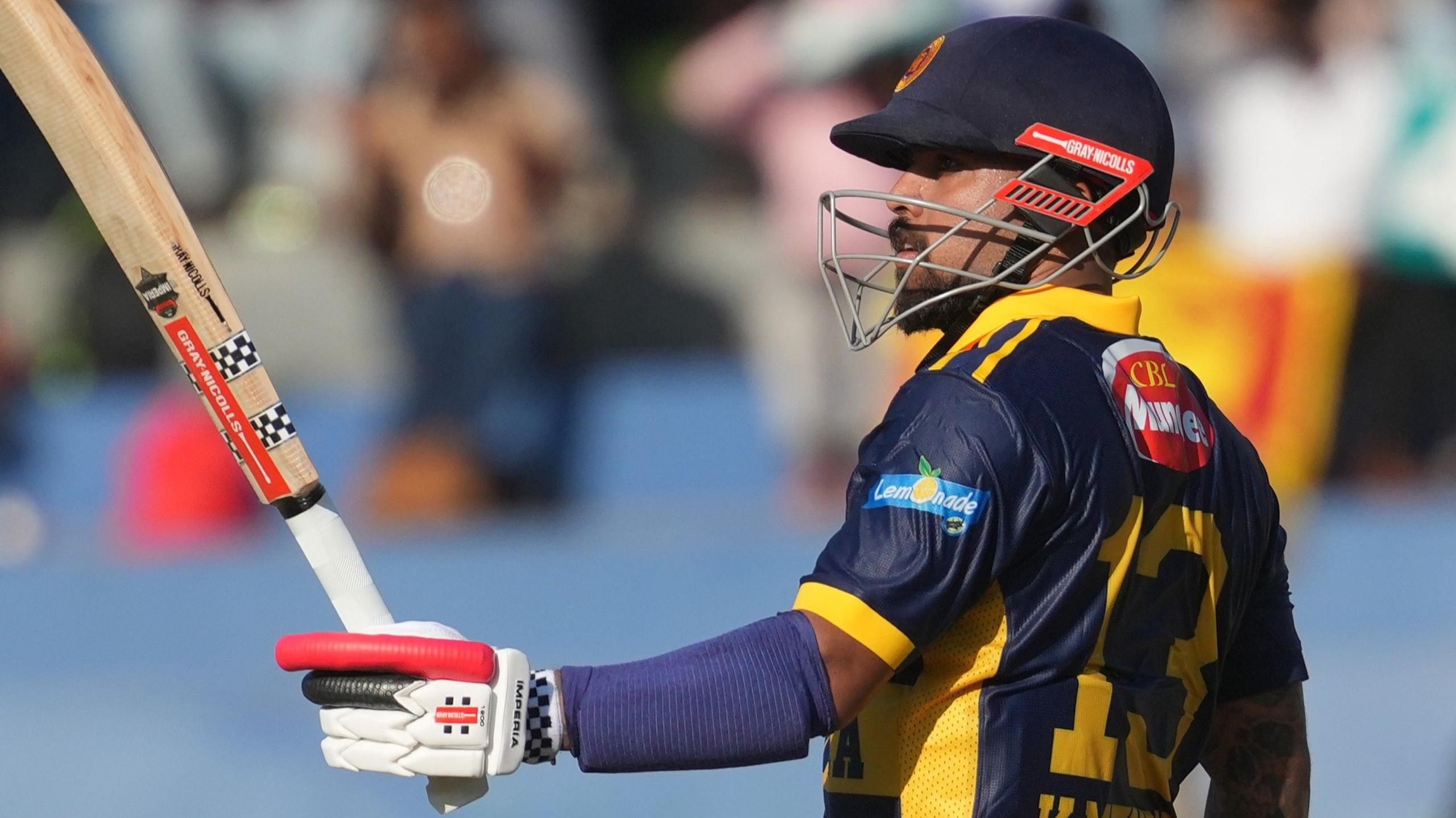 Kusal Mendis raises his bat