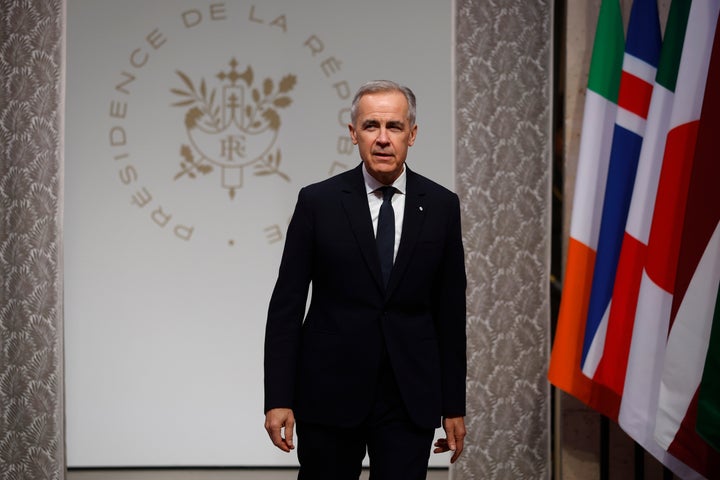 Canadian Prime Minister Mark Carney arrives for a meeting of the Coalition of the Willing at the Elysee Palace in Paris, France, Tuesday, Jan.6, 2026. (Yoan Valat, Pool photo via AP)