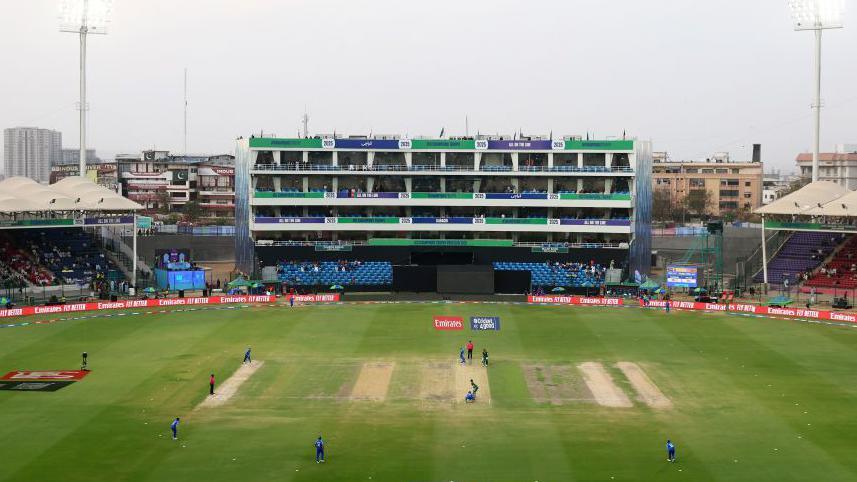 A wide angle of players on the pitch at National Stadium in Karachi