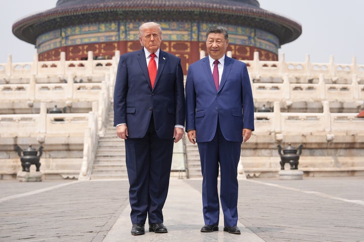 President Donald Trump, left, stands with Chinese President Xi Jinping at the Temple of Heaven on May 14, 2026, in Beijing.