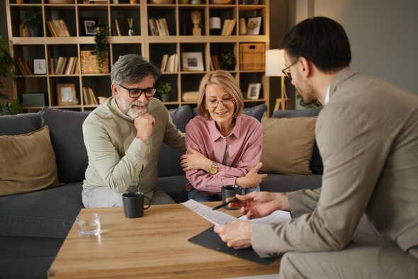 Financial consultant meeting with a mature adult couple Financial consultant meeting with a mature adult couple