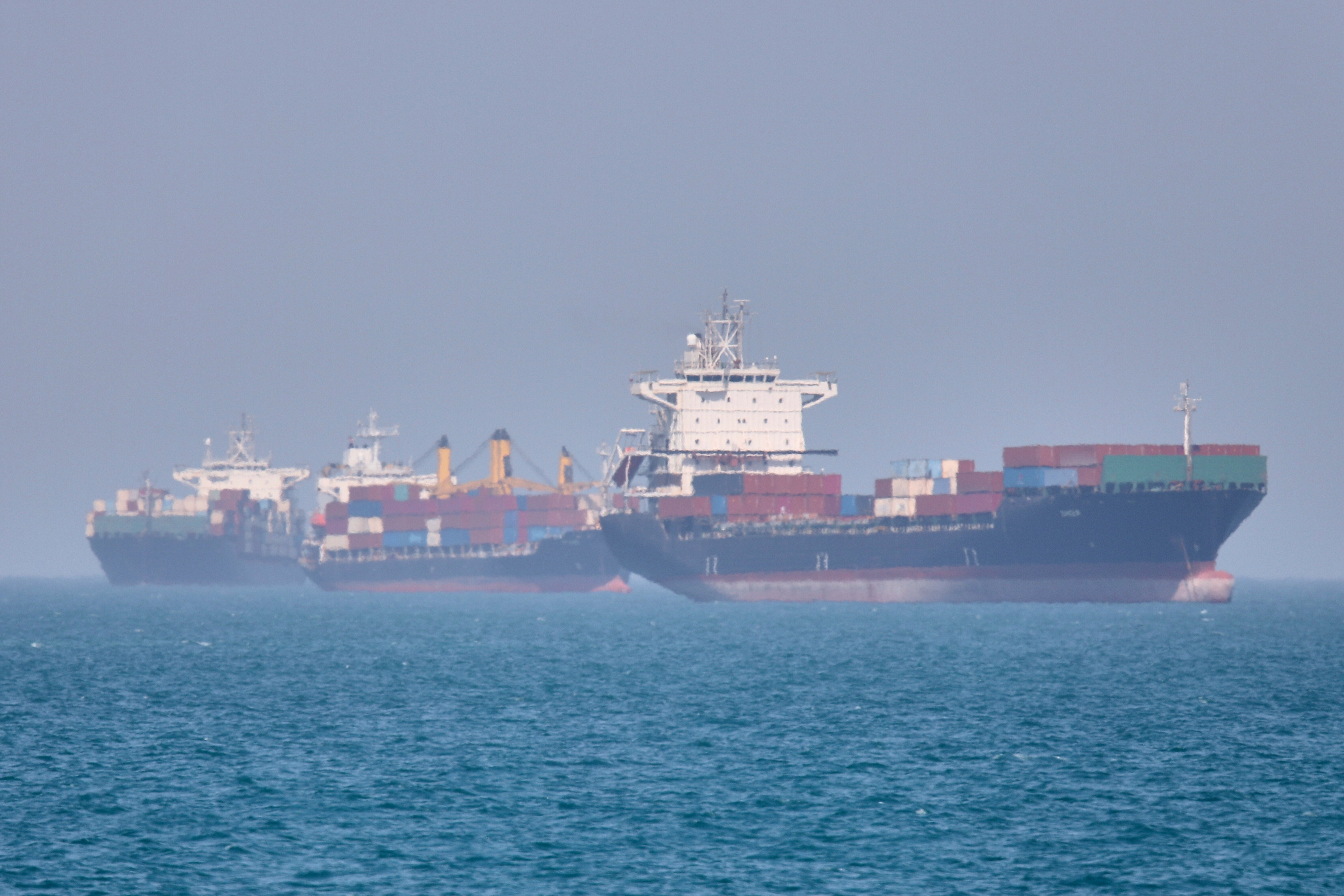 Container ships sit at anchor in the Strait of Hormuz off Bandar Abbas, Iran, Saturday, May 2, 2026.(Amirhosein Khorgooi/ISNA via AP)