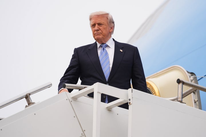 President Donald Trump boards Air Force One, Friday, May 15, 2026, at Beijing Capital International Airport in Beijing. (AP Photo/Mark Schiefelbein)