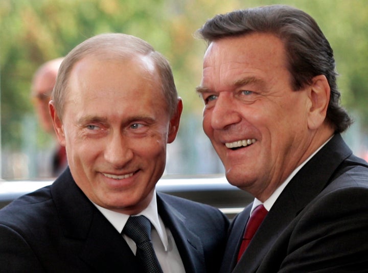 File--- File photo shows German Chancellor Gerhard Schroeder, right, welcoming Russia's President Vladimir Putin in Berlin, Germany, Thursday Sept. 8, 2005. (AP Photo/Herbert Knosowski,file)
