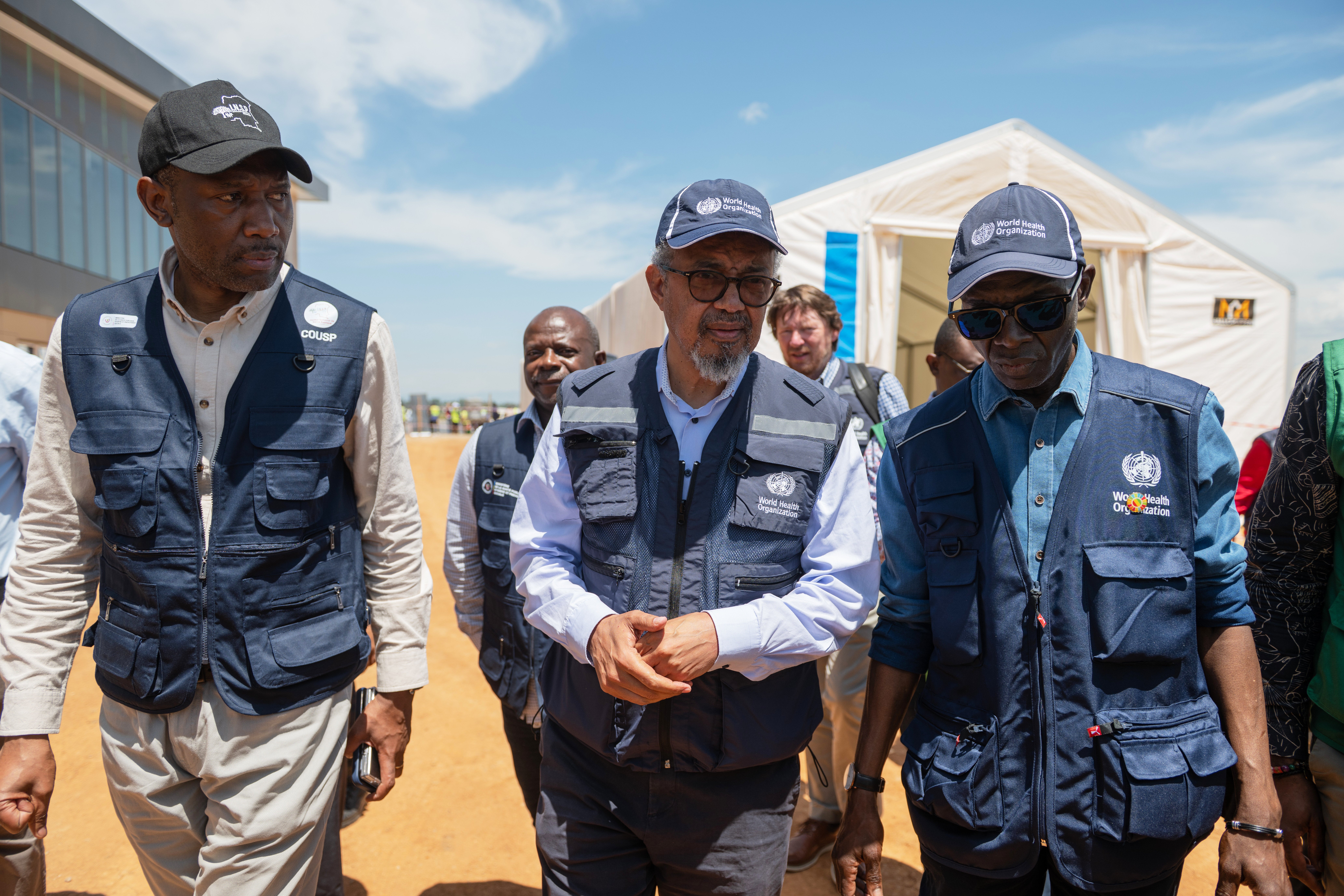 Director General of the World Health Organisation (WHO), Tedros Adhanom Ghebreyesus, center, arrives in Bunia, Congo, Saturday, May 30, 2026. (AP Photo/Moses Sawasawa)