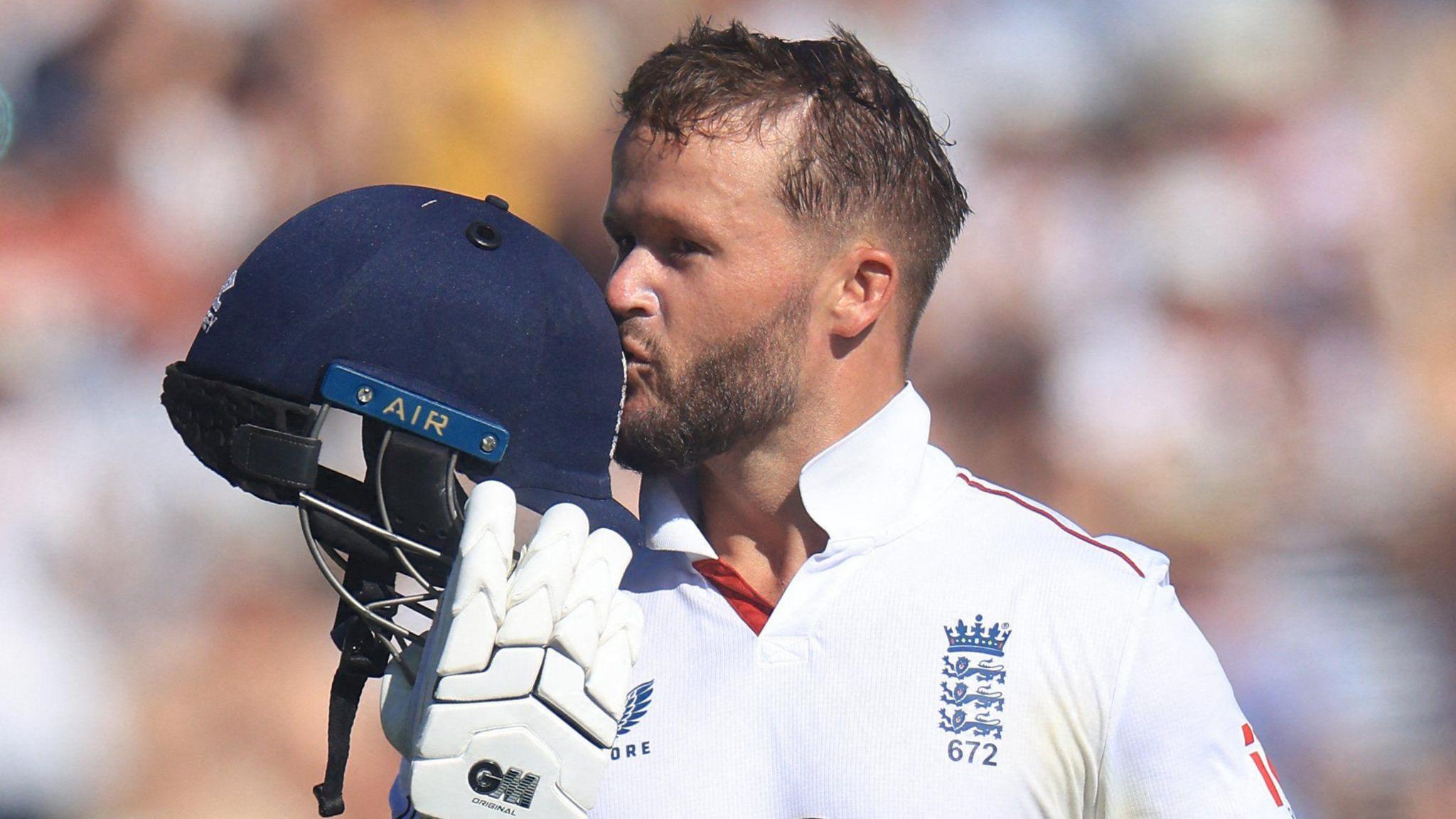 England opener Ben Duckett kisses the badge on his helmet after hitting a century