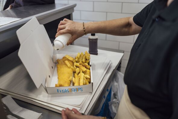 Pouring Salt on Fish and Chips Pouring Salt on Fish and Chips