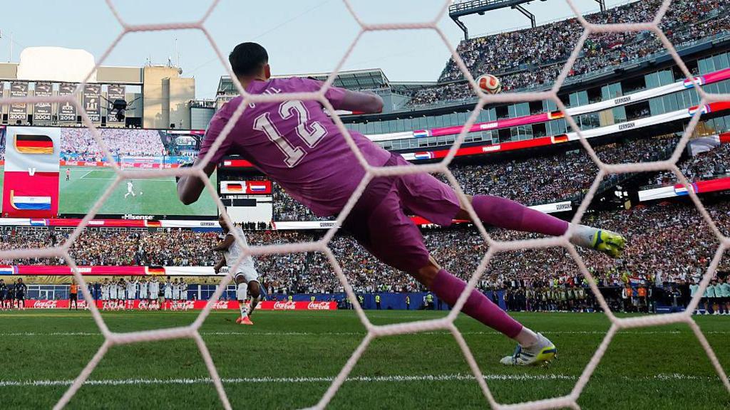 Jonathan Tah hits his penalty over the bar