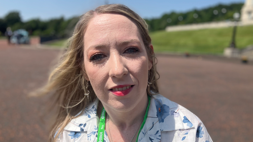 Dr Clodagh Corrigan, a woman with blonde hair, wearing a white and blue blouse.