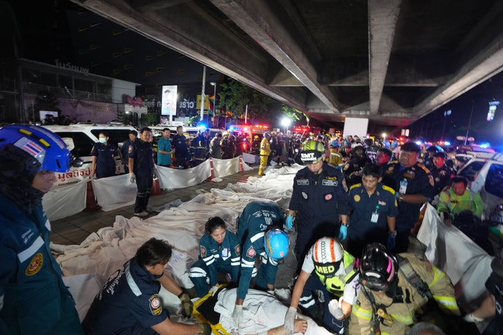 Bodies of victims of a fire are laid in a row in Bangkok, Thailand, on July 13, 2026.