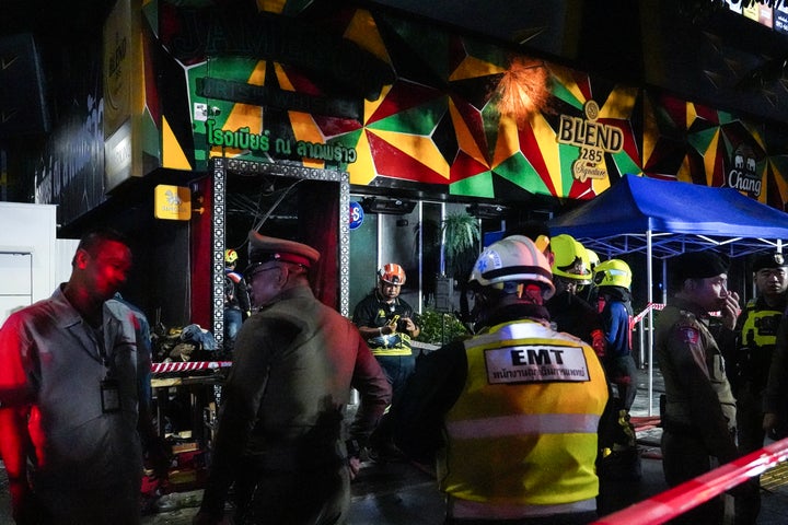 Members of emergency personnel work at the site of a deadly fire at a pub in Bangkok, Thailand, on July 13, 2026. A large fire engulfed the pub, resulting in the deaths of at least 27 people before firefighters were able to bring the blaze under control, according to officials.