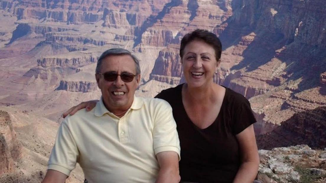 Geoffrey and Carole Murrell smiling in front of some canyons