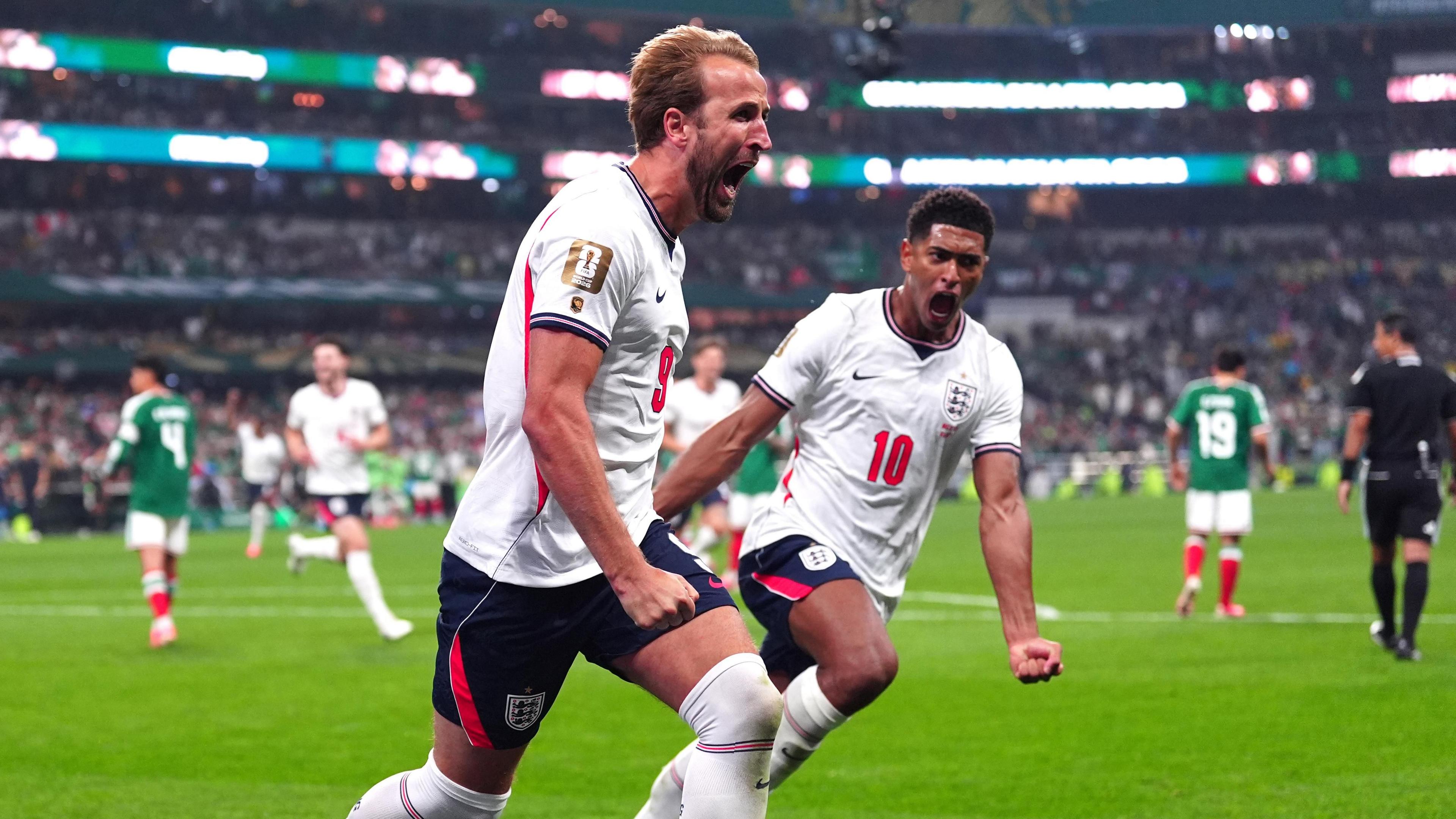 Harry Kane and Jude Bellingham celebrate a goal at the World Cup