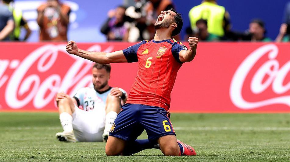 Mikel Merino celebrates his winning goal for Spain