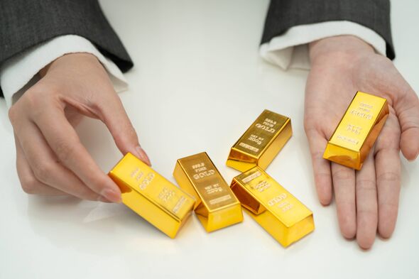 Asian woman holding gold bar in finance business. Asian woman holding gold bar in finance business.