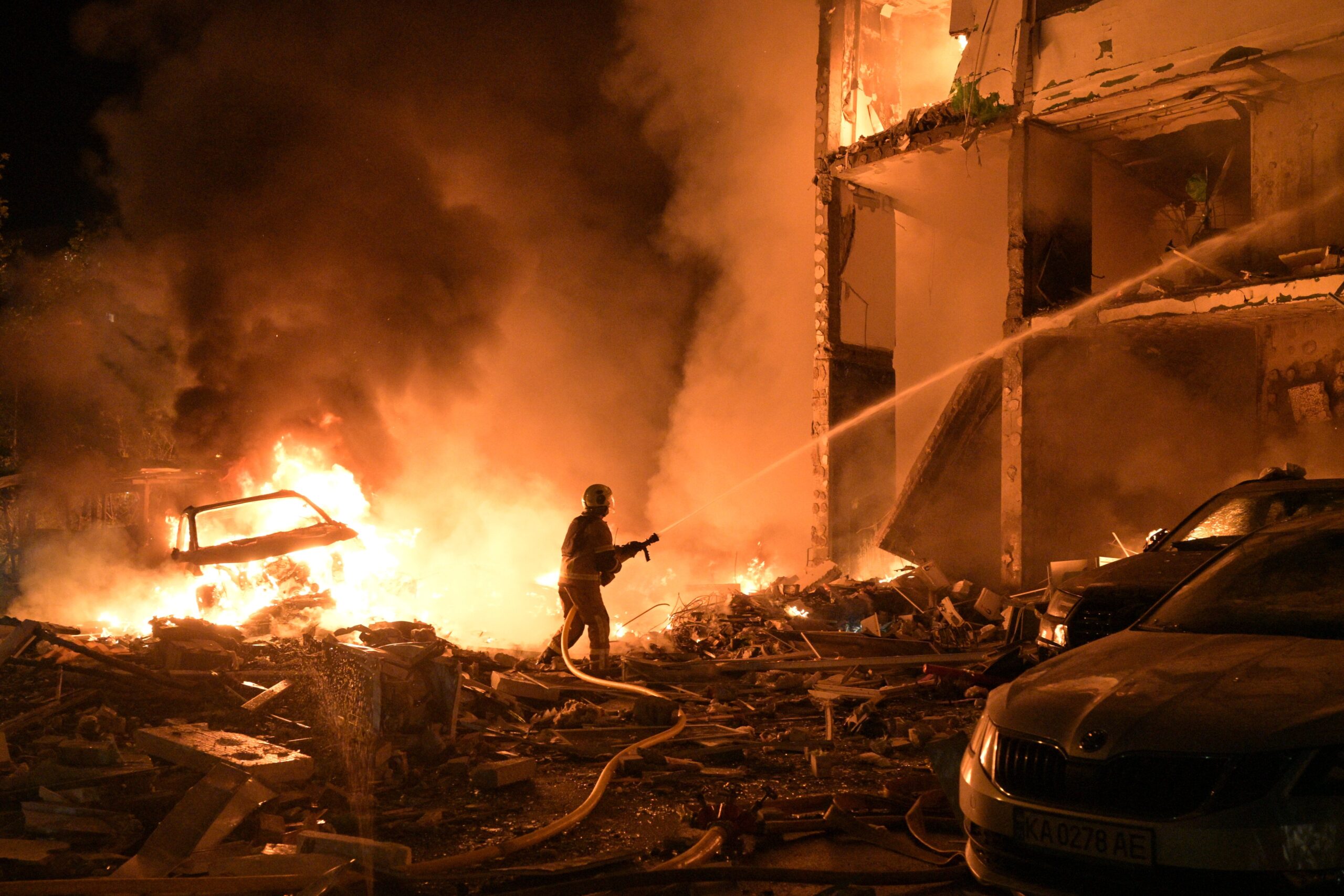Emergency services personnel work to extinguish a fire following Russian missile attacks in Kyiv, Ukraine, on July 6, 2026.
