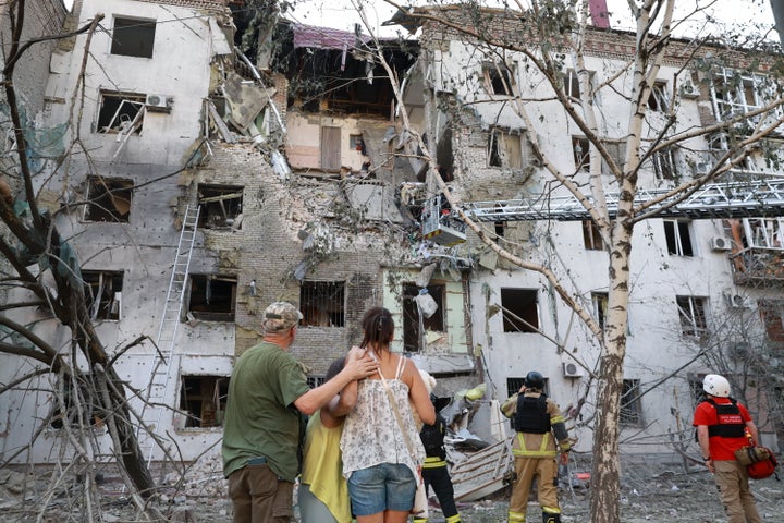 Residents look at their ruined home following a Russian air guided bomb strike in Zaporizhzhia, Ukraine, on July 19, 2026.