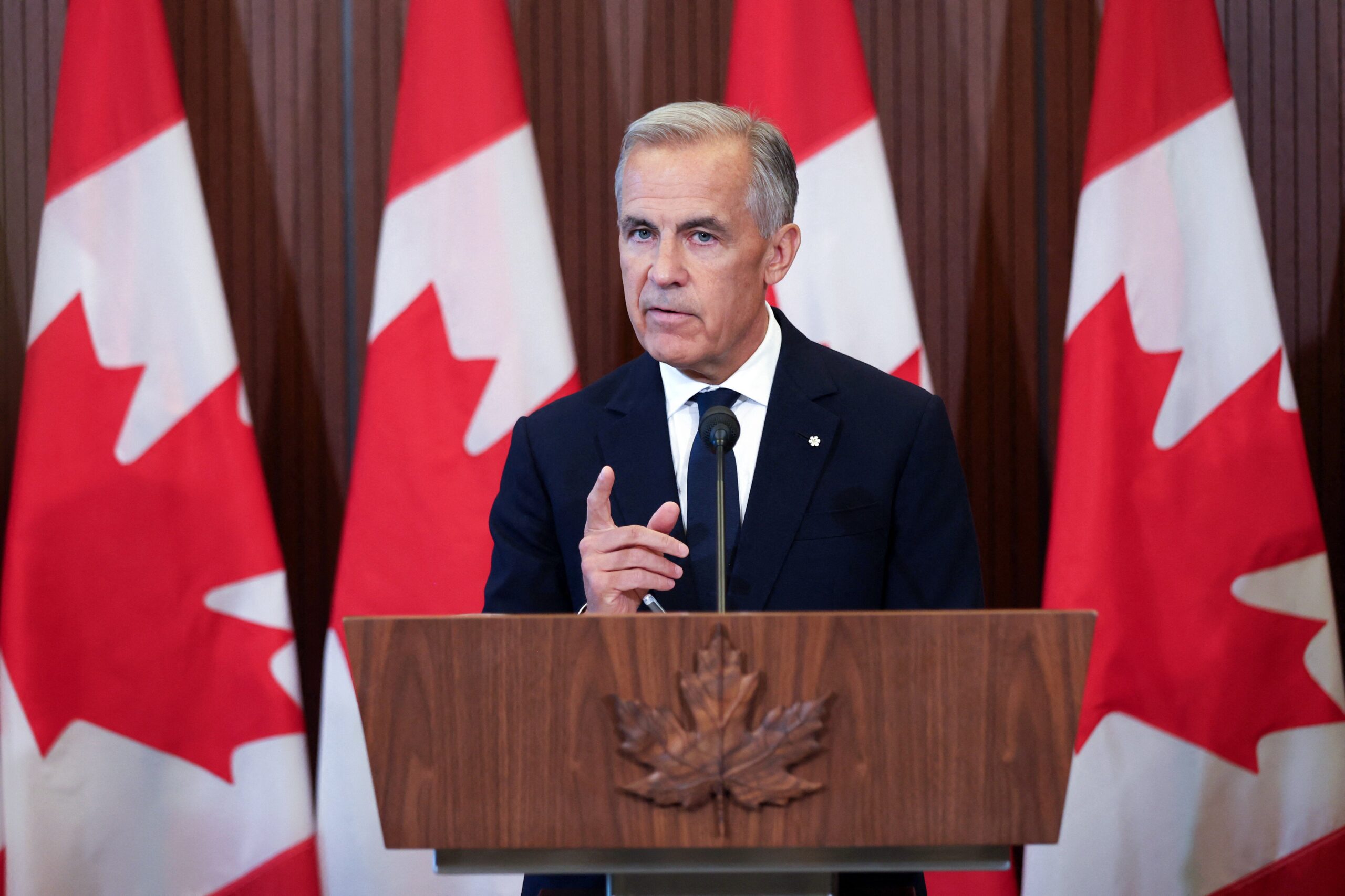 TOPSHOT - Canadian Prime Minister Mark Carney speaks at a press conference in Ottawa, Ontario, on August 22, 2026 after trade talks with the US collapsed. Carney said his country could not accept US terms for a trade deal, and would slap retaliatory tariffs on steel and dairy products in response to heavy duties imposed by Washington. "We cannot accept what they've offered, and we will not give what they've asked," Carney said in remarks on the failed negotiations, adding that Ottawa's new trade measures would take effect on September 8. (Photo by Dave Chan / AFP via Getty Images)
