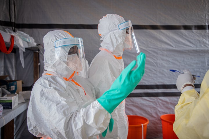 Medical workers put on protective suits at an Ebola treatment center in Bunia, the capital of Ituri Province in the Democratic Republic of the Congo, July 6, 2026.